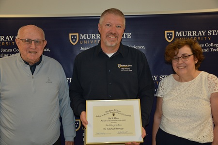 A photo of Dr. Ramage receiving his award. 