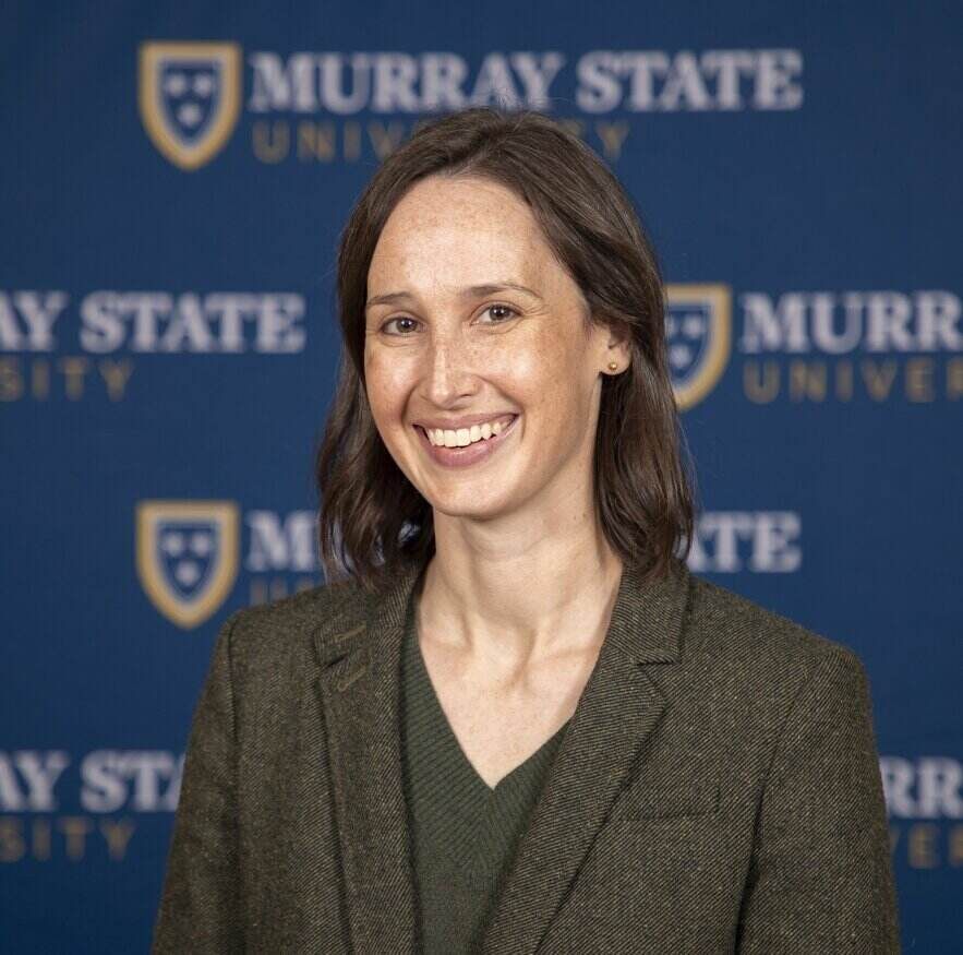 Dr. Alexandra Hendley in front of a Murray State University background.