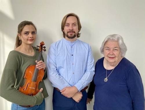 Violinist, Lydia Sahawneh, is pictured with luthier Dr. Roger Graves and Mrs. Donna Herndon