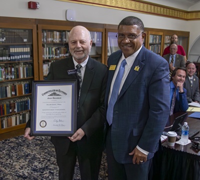 A photo of Dr. Whaley accepting his recognition.