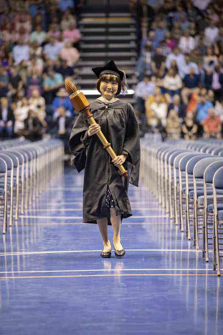 Yoko Hatakeyama carrying mace during graduation ceremony