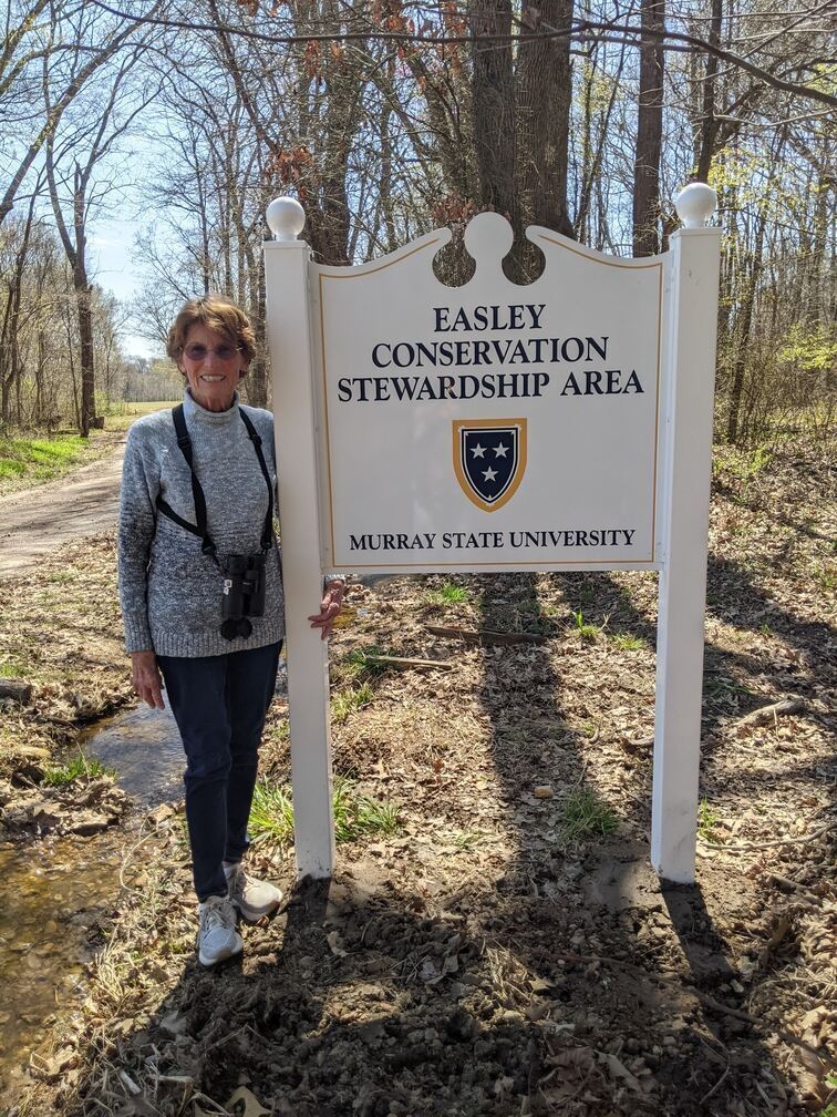 Melissa Easley next to Easley Conservation Stewardship Area sign