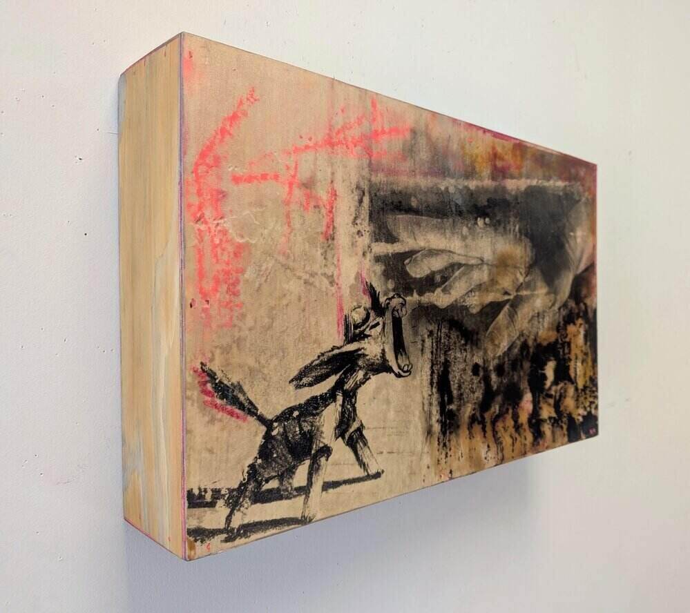 beige art panel hanging on white wall