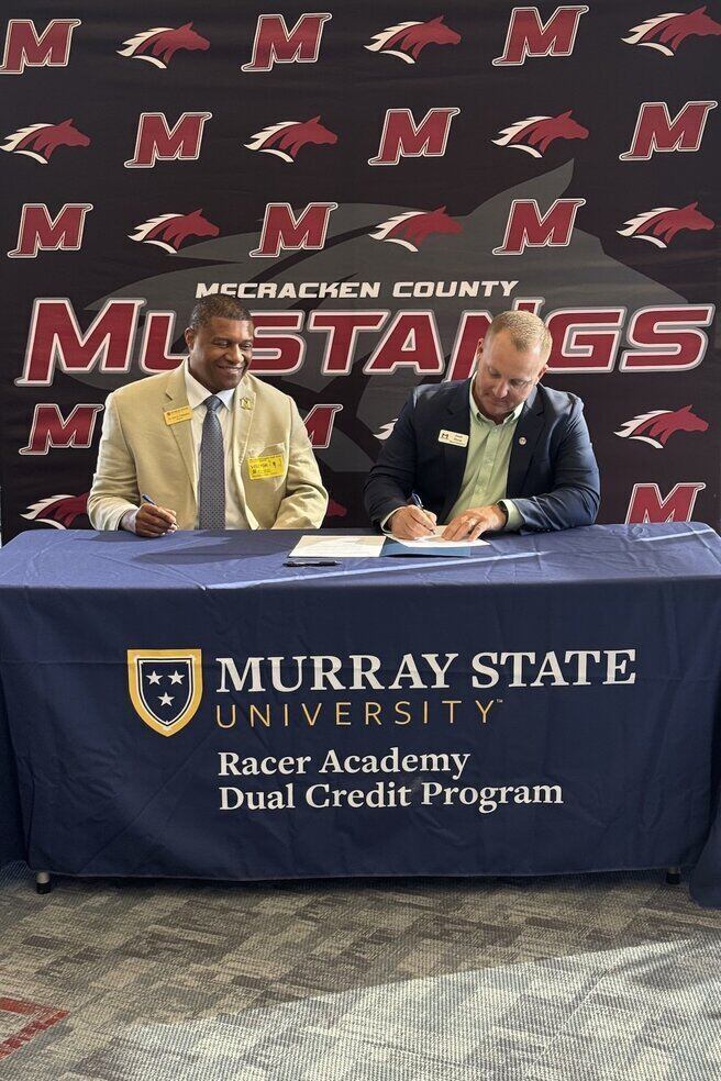 Dr. Ron K. Patterson and Superintendent Josh Hunts signing partnership