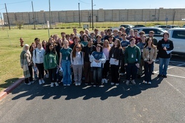 Group of high school students standing outside